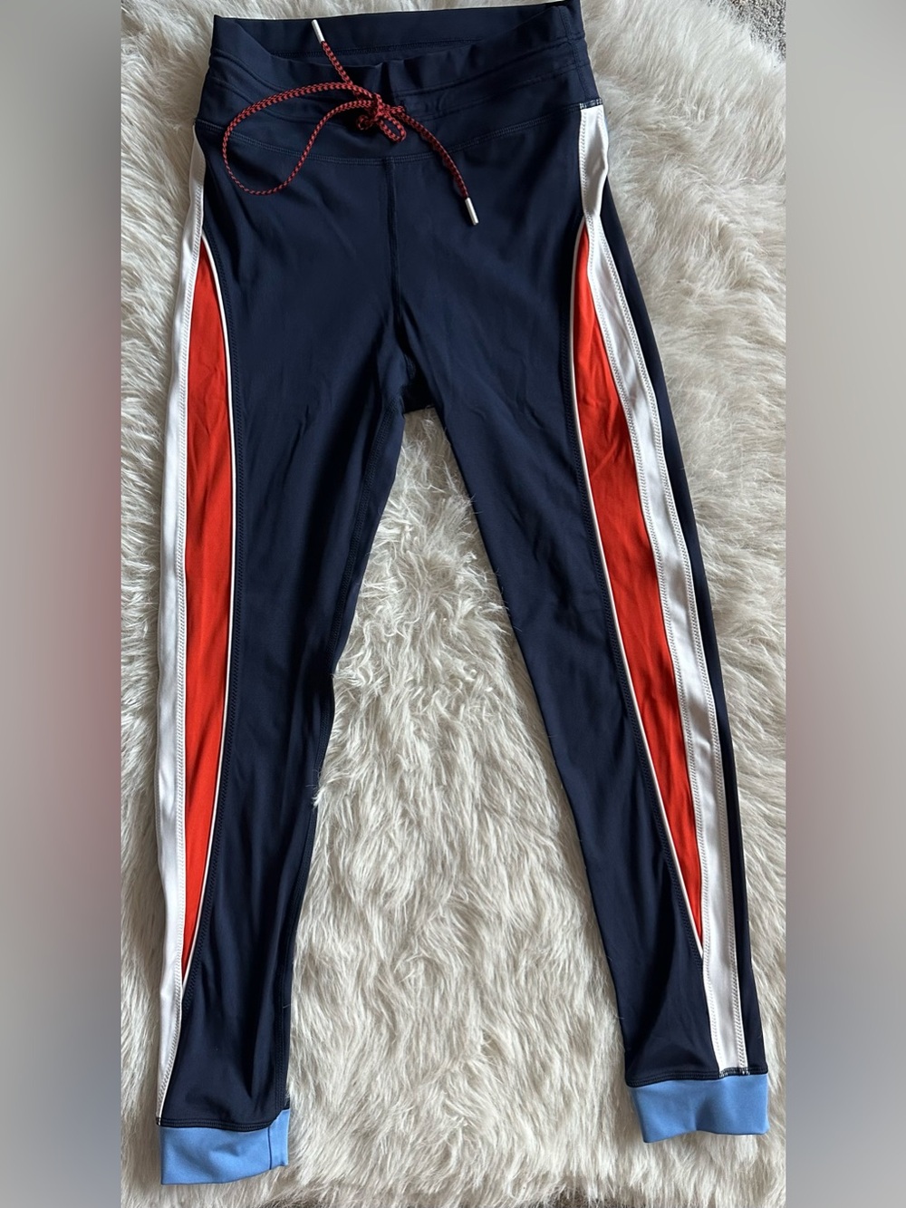 The Upside Revolve Navy Track Leggings with Orange and White Side Stripes size 4